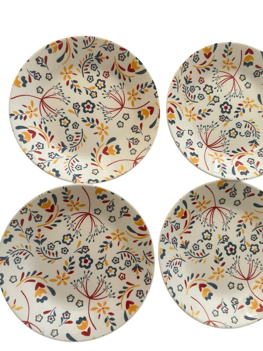 This is a Corelle Prairie Garden Red 6.75-inch bread and butter plate. Set of 4